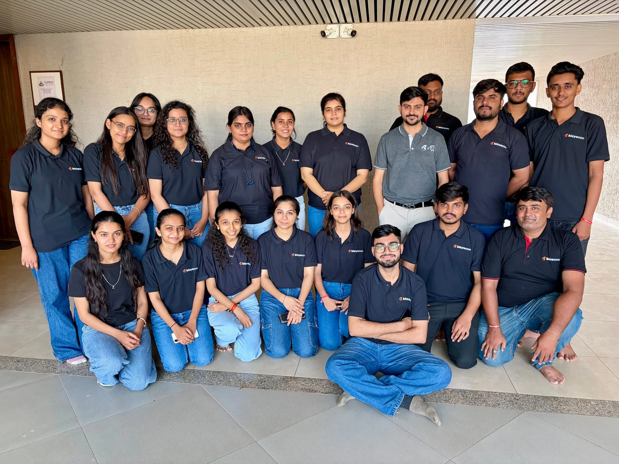 The Bizyocon team in branded navy polo shirts, Gandhinagar