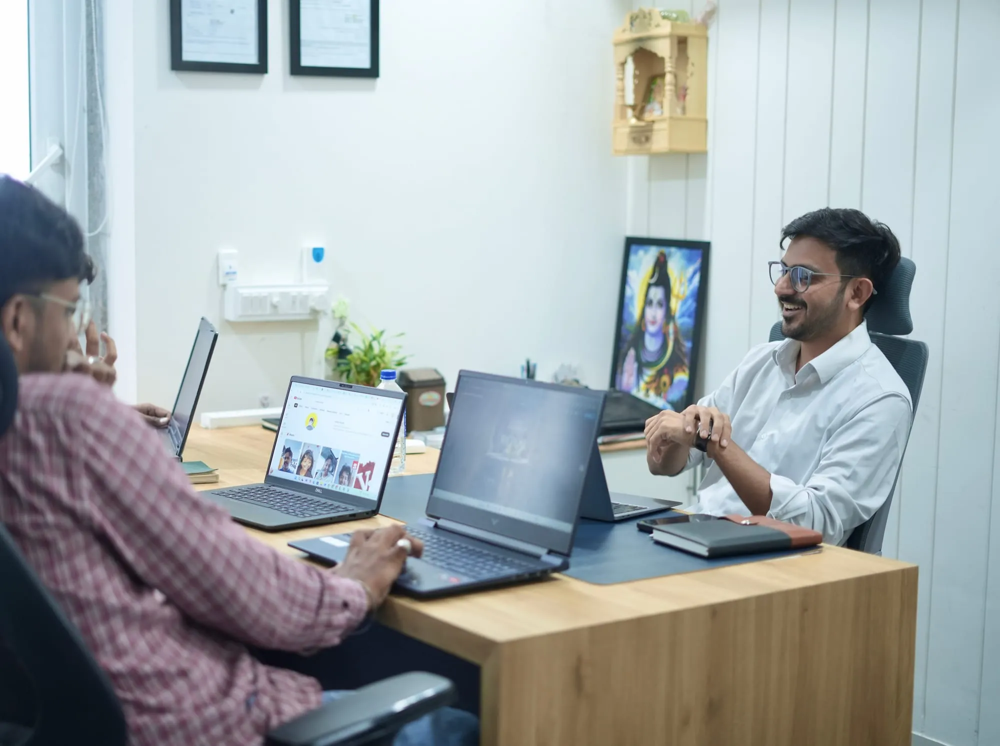 Mukesh Chaudhary in a client consultation Mukesh Chaudhary in a strategy consultation with a client at his office