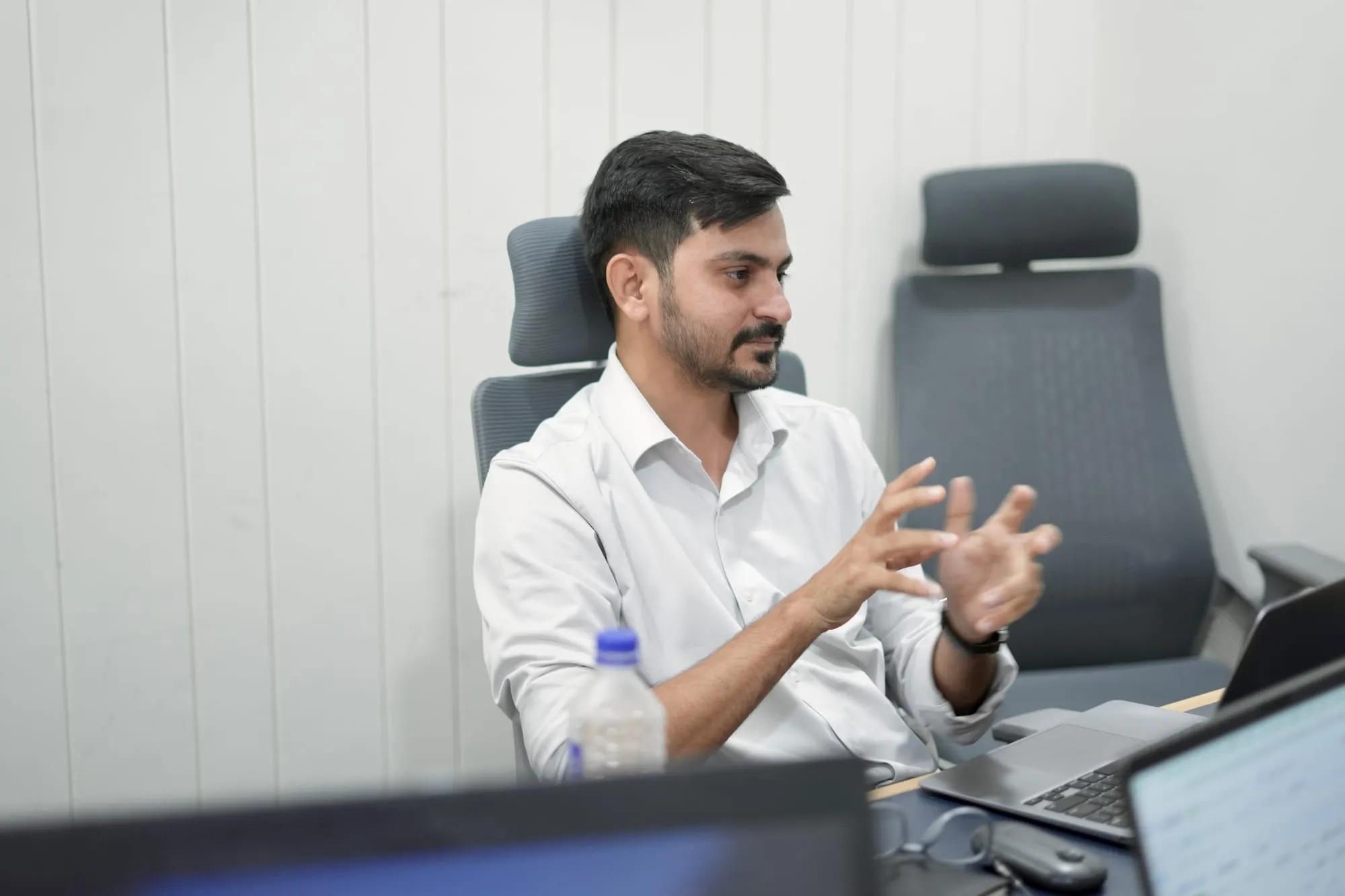 Mukesh Chaudhary explaining a growth strategy Mukesh Chaudhary explaining a marketing strategy during a meeting